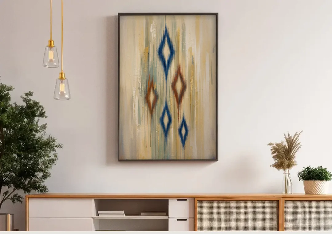 Framed Abstract Painting of Drifting Ikat Diamonds canvas wall art above a wooden sideboard under pendant lights