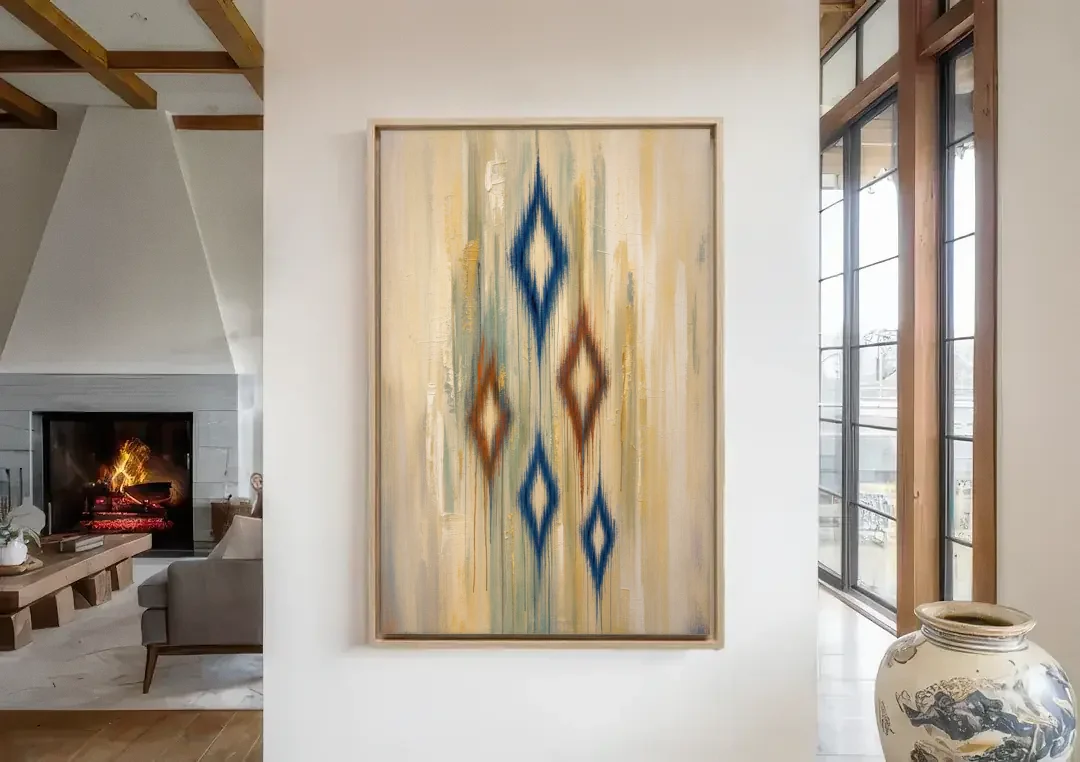Framed Abstract Painting of Drifting Ikat Diamonds canvas wall art in a living room with a fireplace