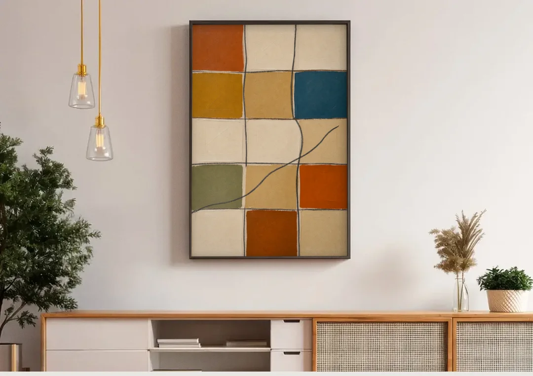 Framed Geometric Wall Art with a Wandering Line canvas wall art above a wooden sideboard under pendant lights