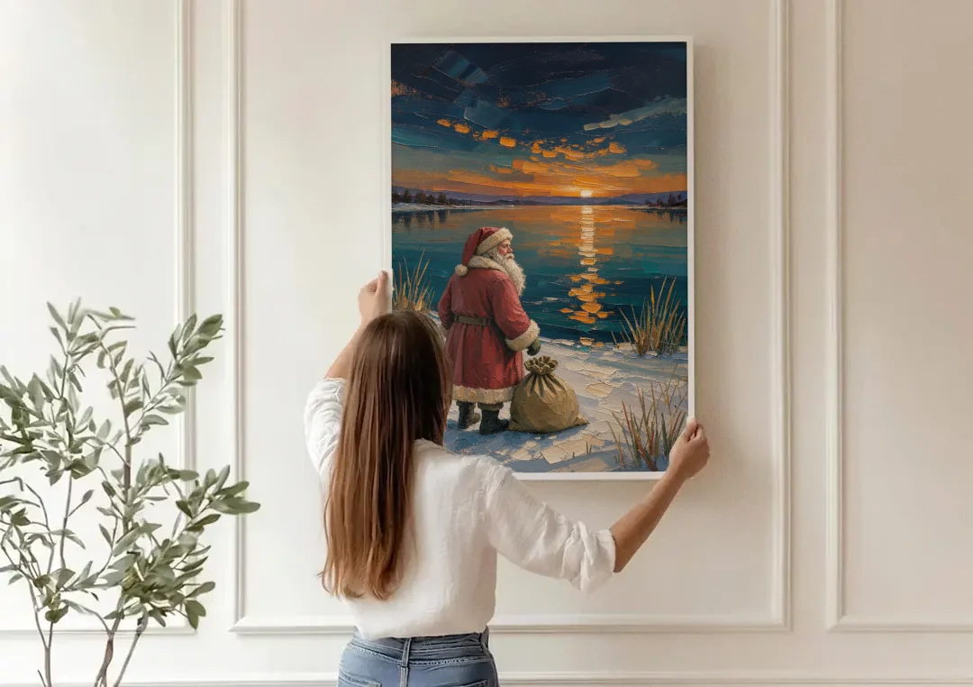 Framed Santa Print by the Amber Lake canvas wall art being hung on a paneled wall