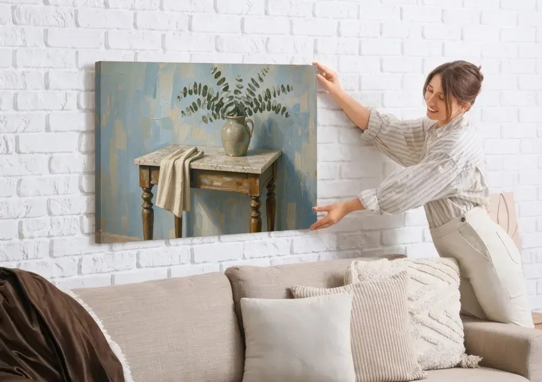 French Country Bathroom Wall Art of a Eucalyptus Washstand canvas wall art being hung on a white brick wall above a sofa