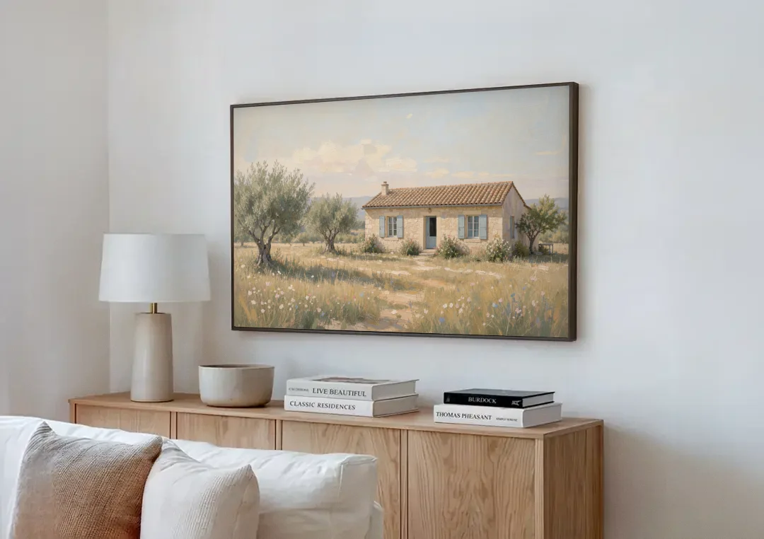 French Country Wall Art of a Provençal Farmhouse canvas wall art above a wooden sideboard next to a sofa