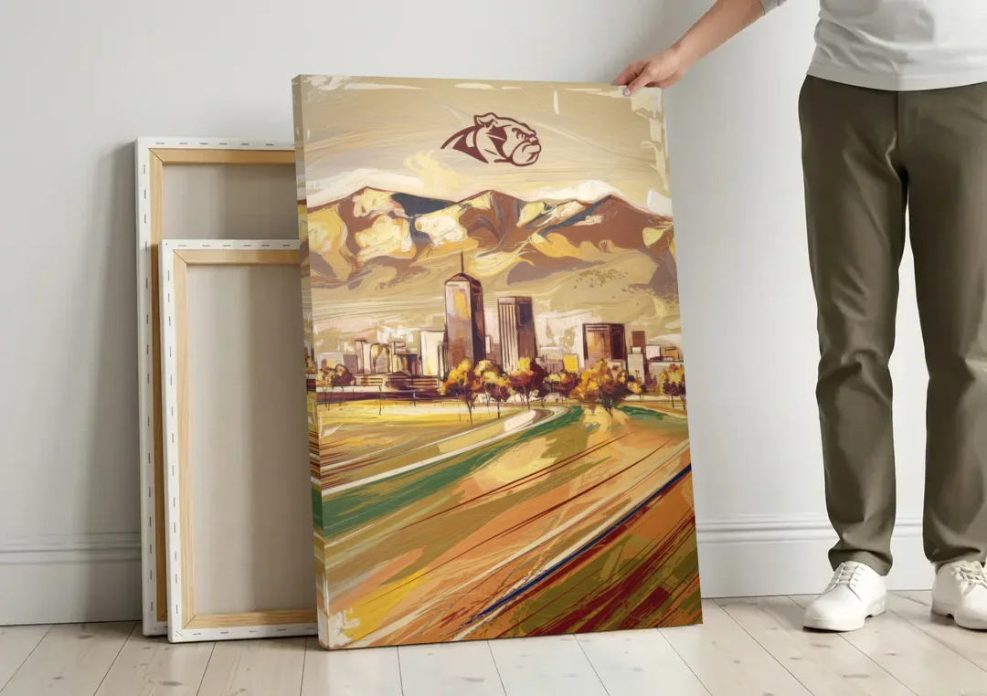 Fresno Cityscape and Team Spirit canvas wall art leaning against a wall next to blank canvases