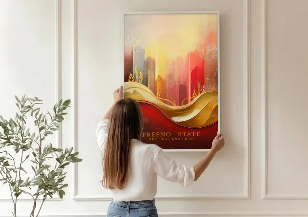 Fresno State Heritage and Pride canvas wall art being hung on a paneled wall