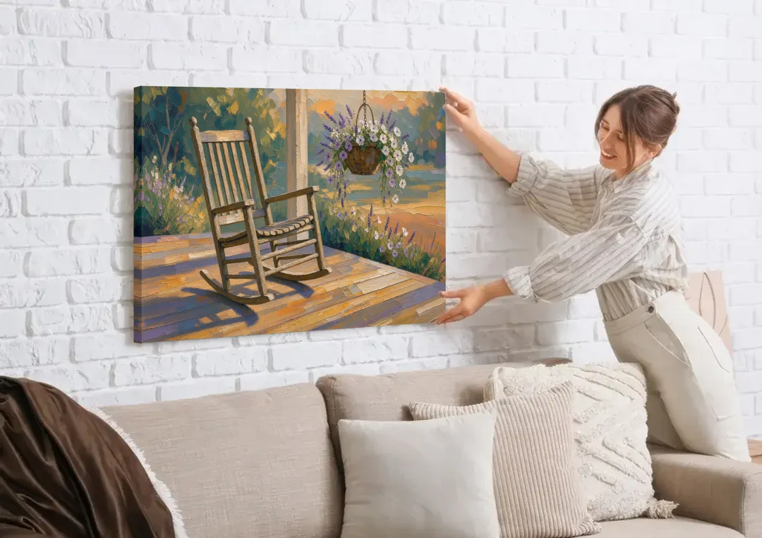 Front Porch Art with Rocking Chair and Lavender Basket canvas wall art being hung on a white brick wall above a sofa
