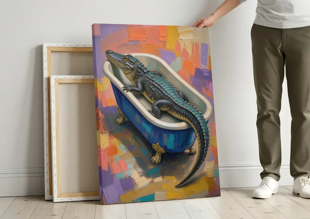 Funny Animal Bathroom Wall Art Alligator Outgrows the Tub canvas wall art leaning against a wall next to blank canvases