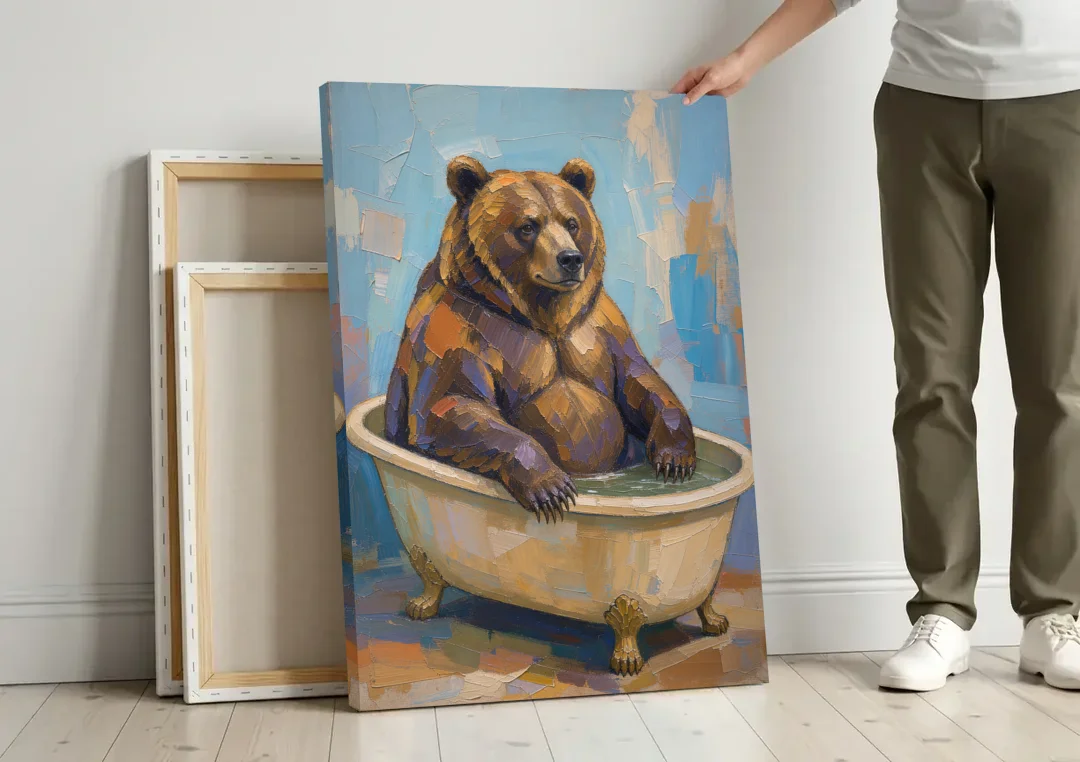 Funny Animal Canvas Art of a Bathing Bear canvas wall art leaning against a wall next to blank canvases