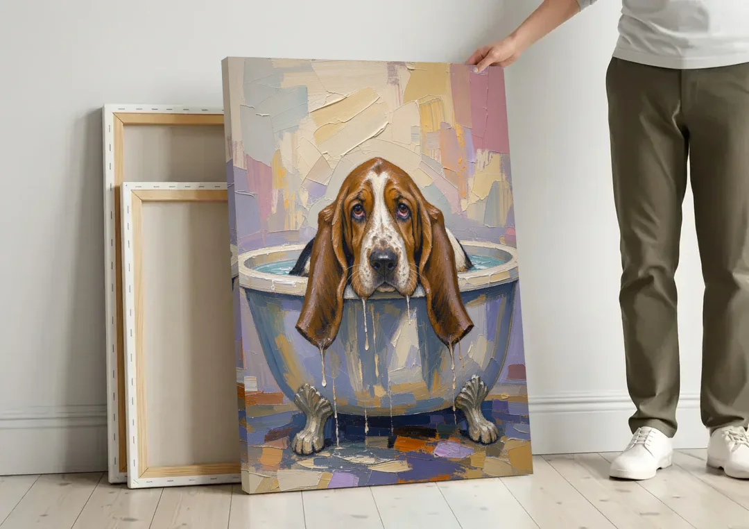 Funny Bathroom Canvas Art Basset Hound with Dripping Ears canvas wall art leaning against a wall next to blank canvases