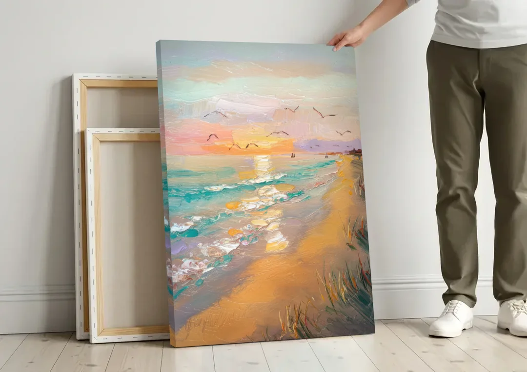 Galveston Beach Sunrise canvas wall art leaning against a wall next to blank canvases