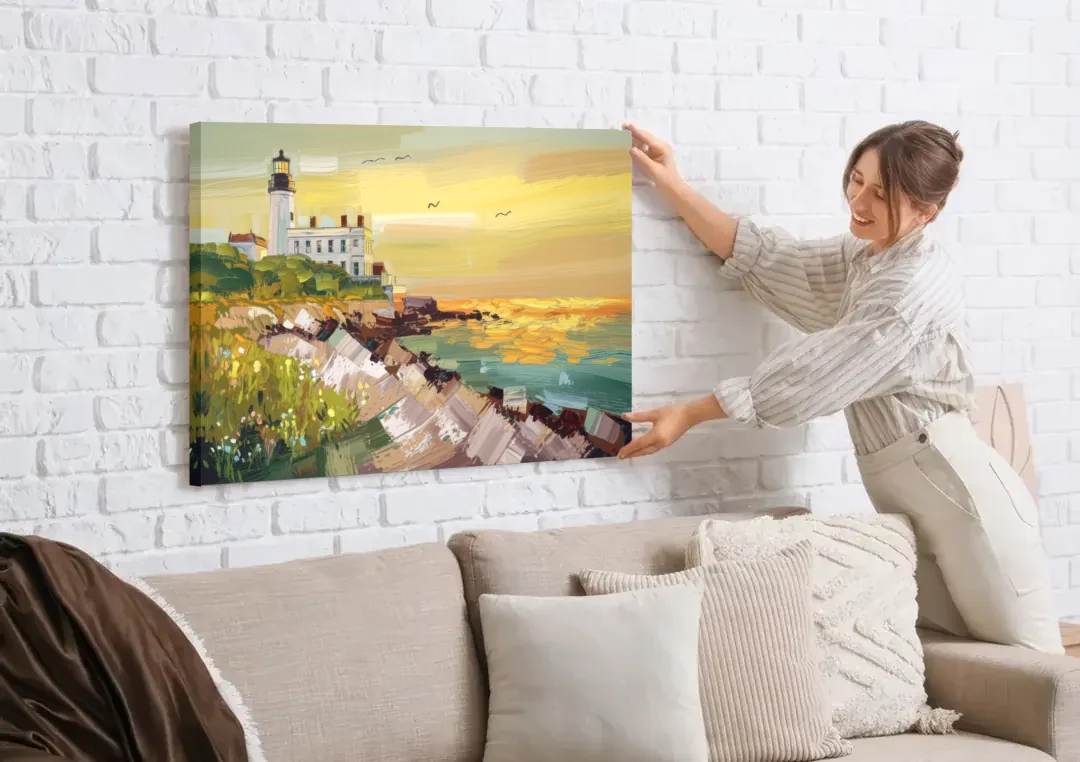 Galveston Lighthouse View canvas wall art being hung on a white brick wall above a sofa