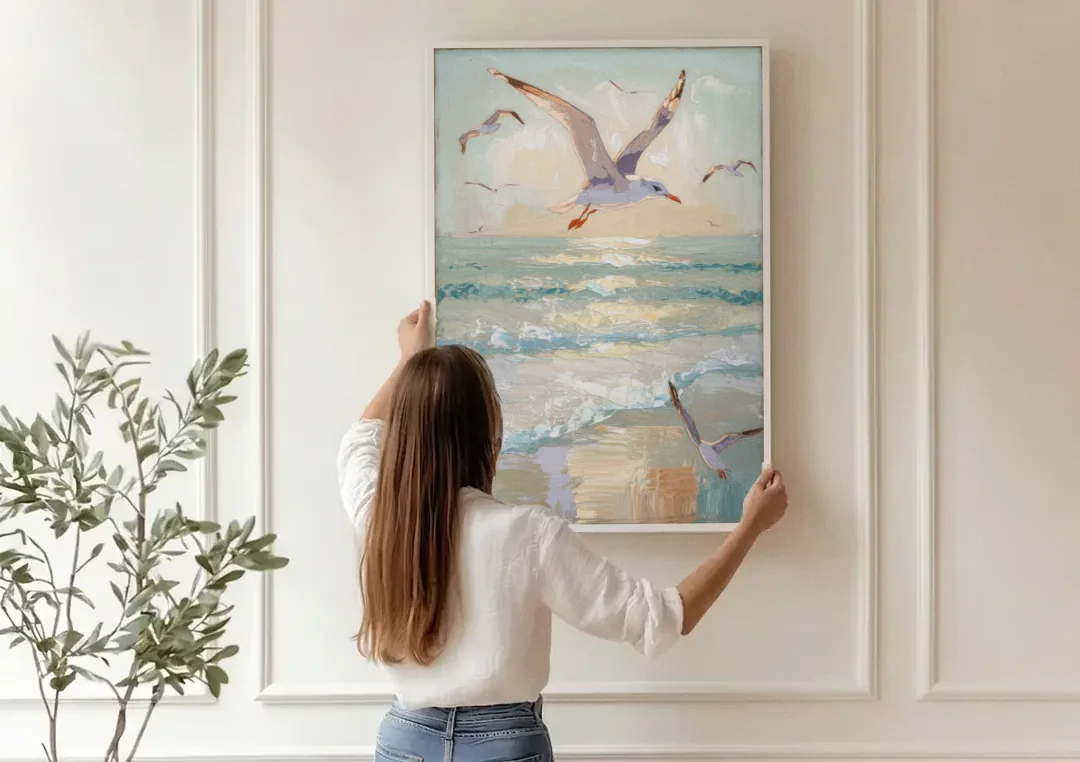 Galveston Seagulls in Flight canvas wall art being hung on a paneled wall