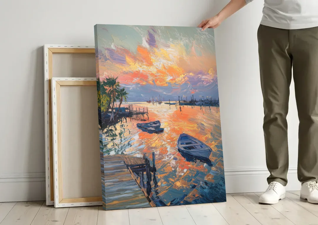 Galveston Sunset Harbor canvas wall art leaning against a wall next to blank canvases