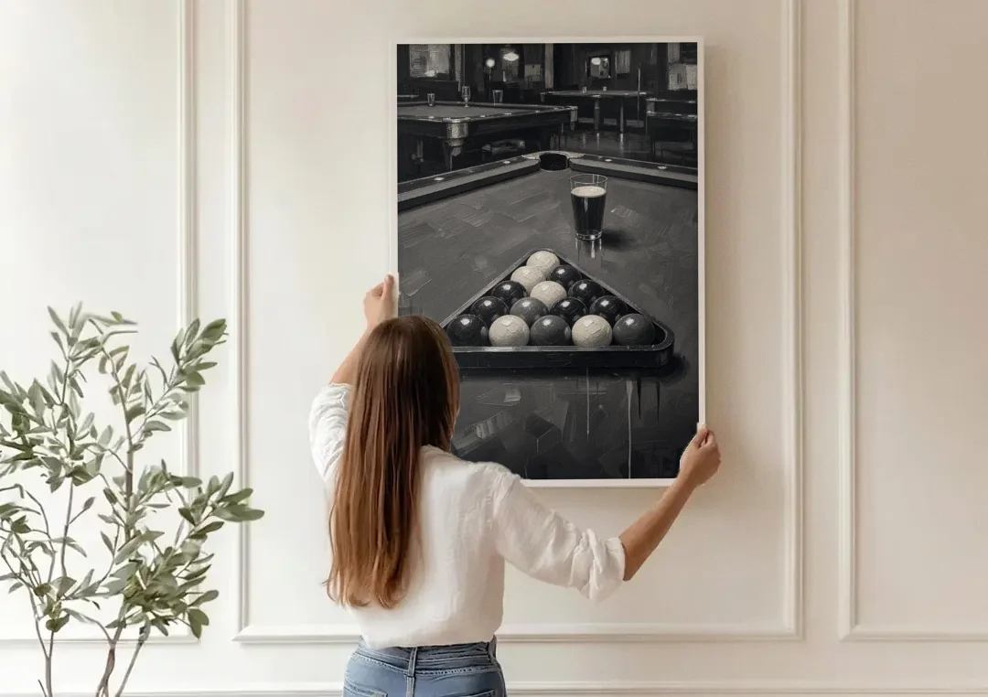 Game Room Wall Art with Racked Balls and Stout canvas wall art being hung on a paneled wall