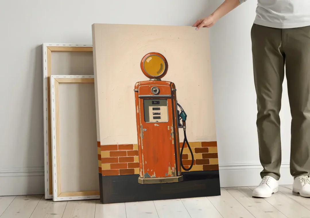 Garage Art Faded Red Gas Pump canvas wall art leaning against a wall next to blank canvases
