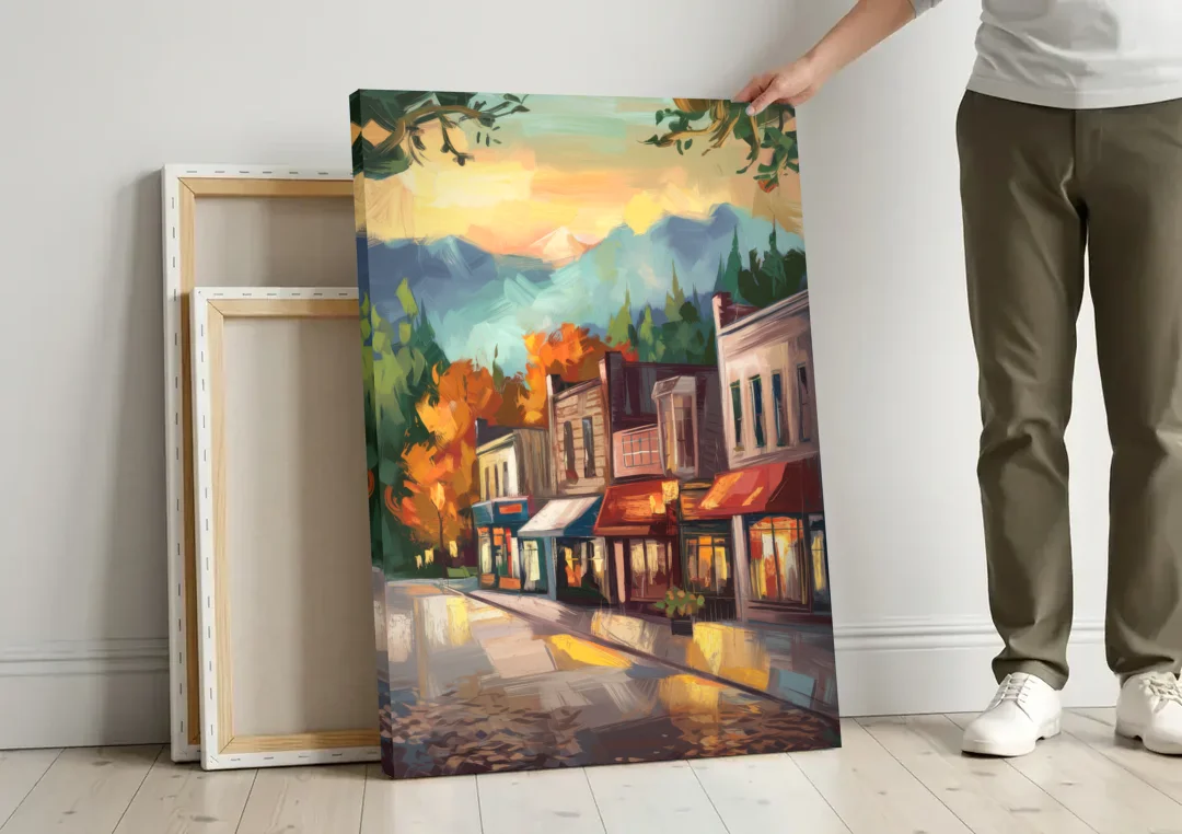 Gatlinburg Downtown Charm canvas wall art leaning against a wall next to blank canvases