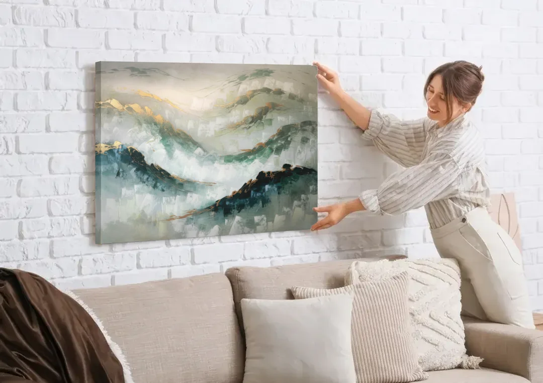 Gatlinburg Misty Mountain Gray Landscape canvas wall art being hung on a white brick wall above a sofa