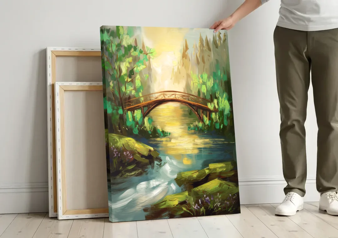 Gatlinburg River and Bridge Scene canvas wall art leaning against a wall next to blank canvases