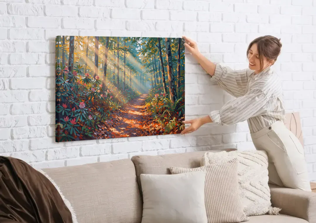 Gatlinburg Trail Through The Forest canvas wall art being hung on a white brick wall above a sofa
