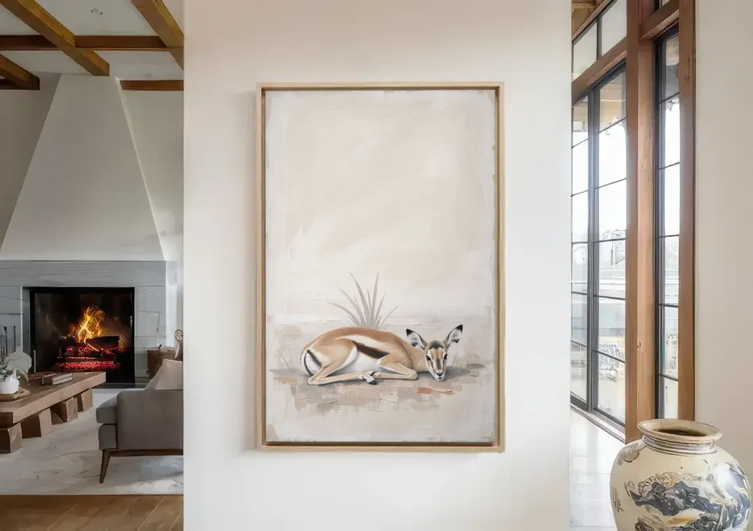 Gazelle Fawn Lying Low in Hiding canvas wall art in a living room with a fireplace