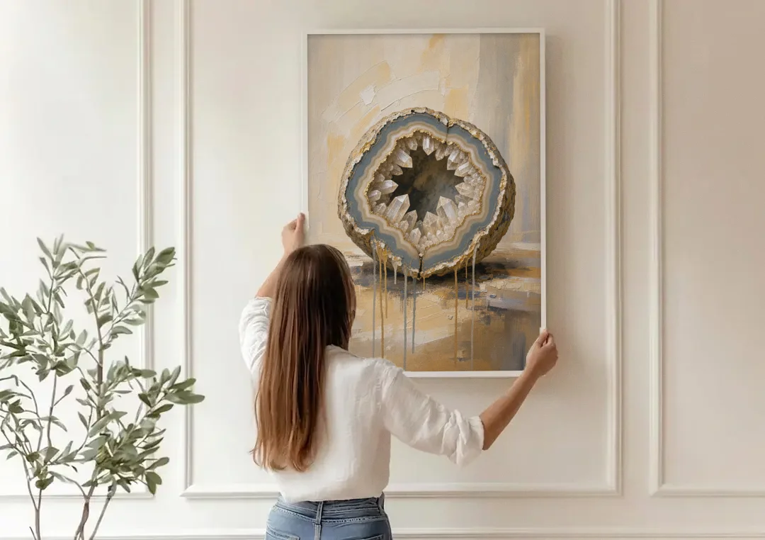 Geode Wall Art with Gold Rimmed Crystal Heart canvas wall art being hung on a paneled wall