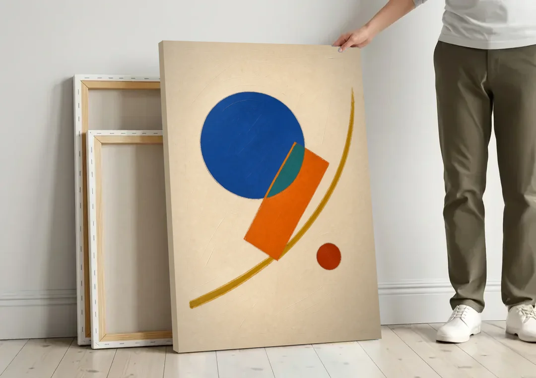 Geometric Abstract Art with Cobalt Sun and Tail Fin canvas wall art leaning against a wall next to blank canvases