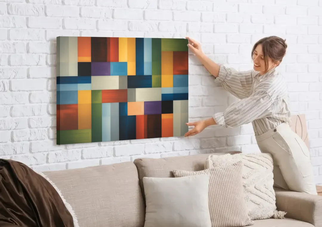 Geometric Harmony Colorful Abstract canvas wall art being hung on a white brick wall above a sofa