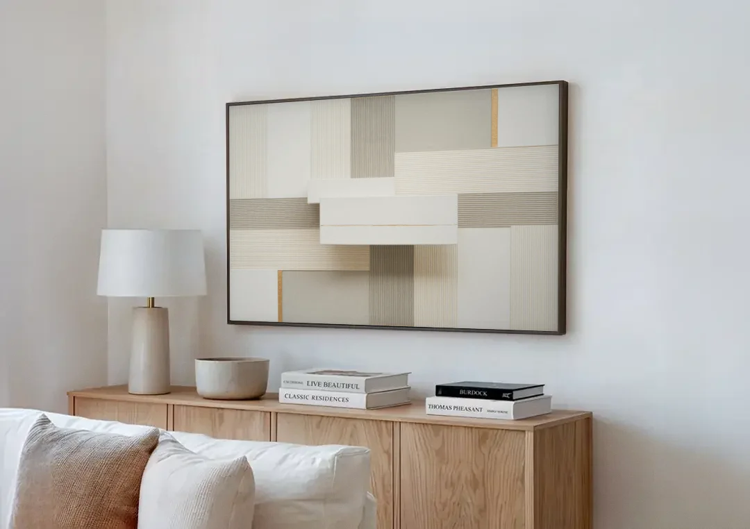 Geometric Harmony in White Abstract canvas wall art above a wooden sideboard next to a sofa