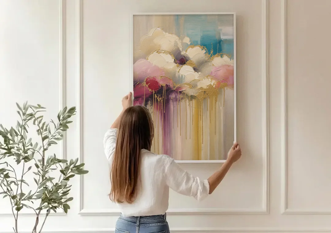 Gilded Clouds With Raspberry Rain Drips canvas wall art being hung on a paneled wall