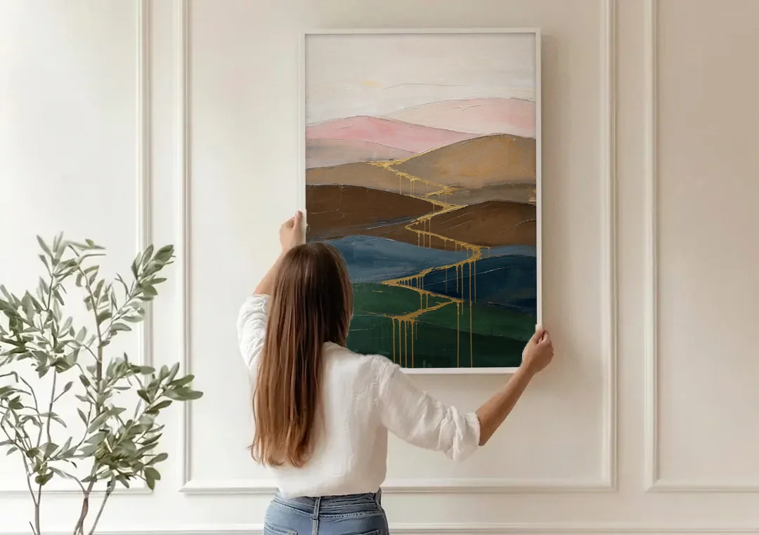 Gold Drip Stream Through Layered Hills canvas wall art being hung on a paneled wall