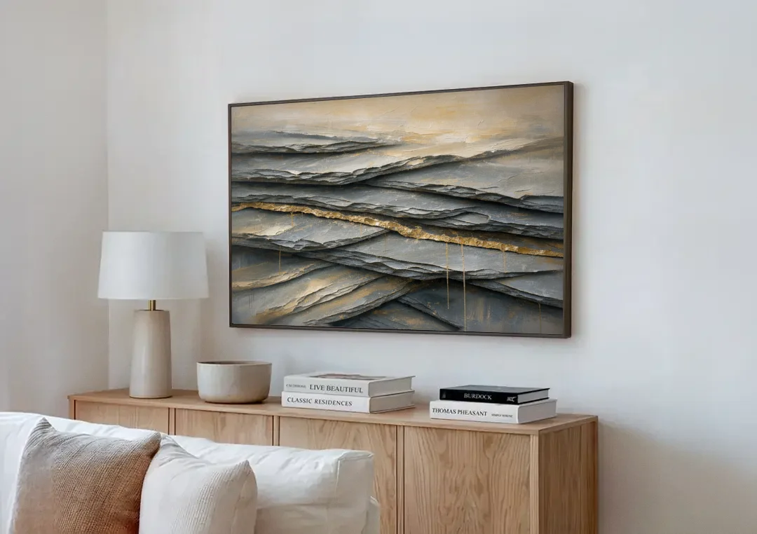 Gold Leaf Abstract Painting of Slate Seams canvas wall art above a wooden sideboard next to a sofa