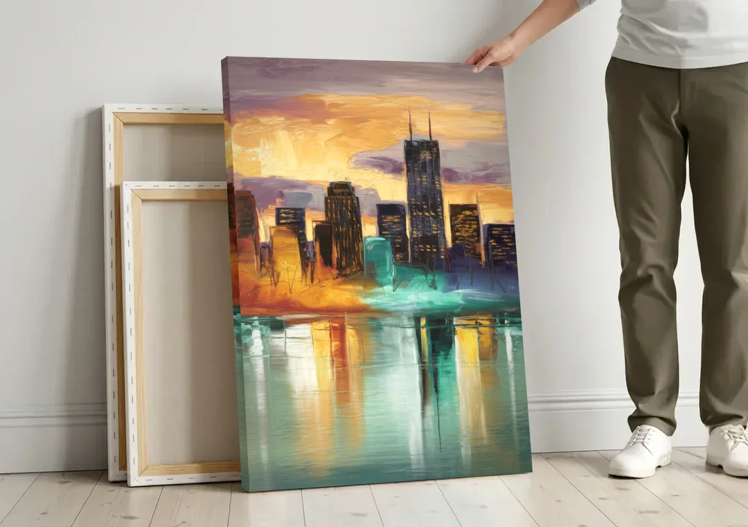 Grand Rapids Cityscape Reflections canvas wall art leaning against a wall next to blank canvases