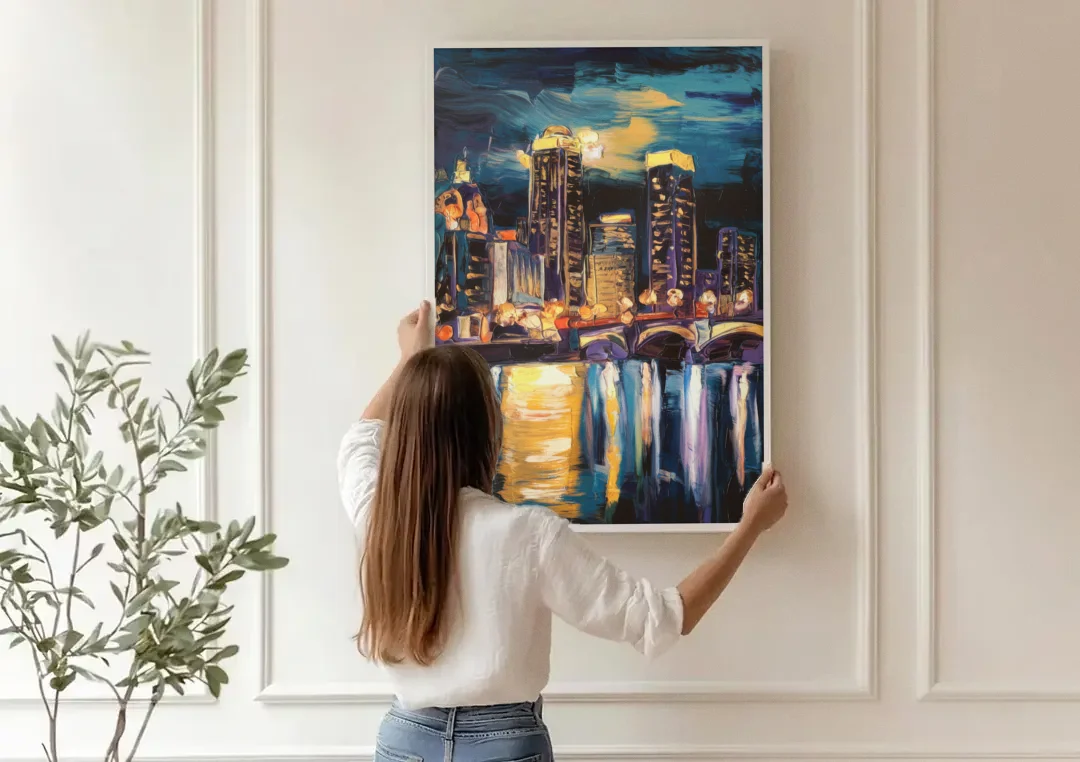 Grand Rapids Nighttime Skyline Glow canvas wall art being hung on a paneled wall
