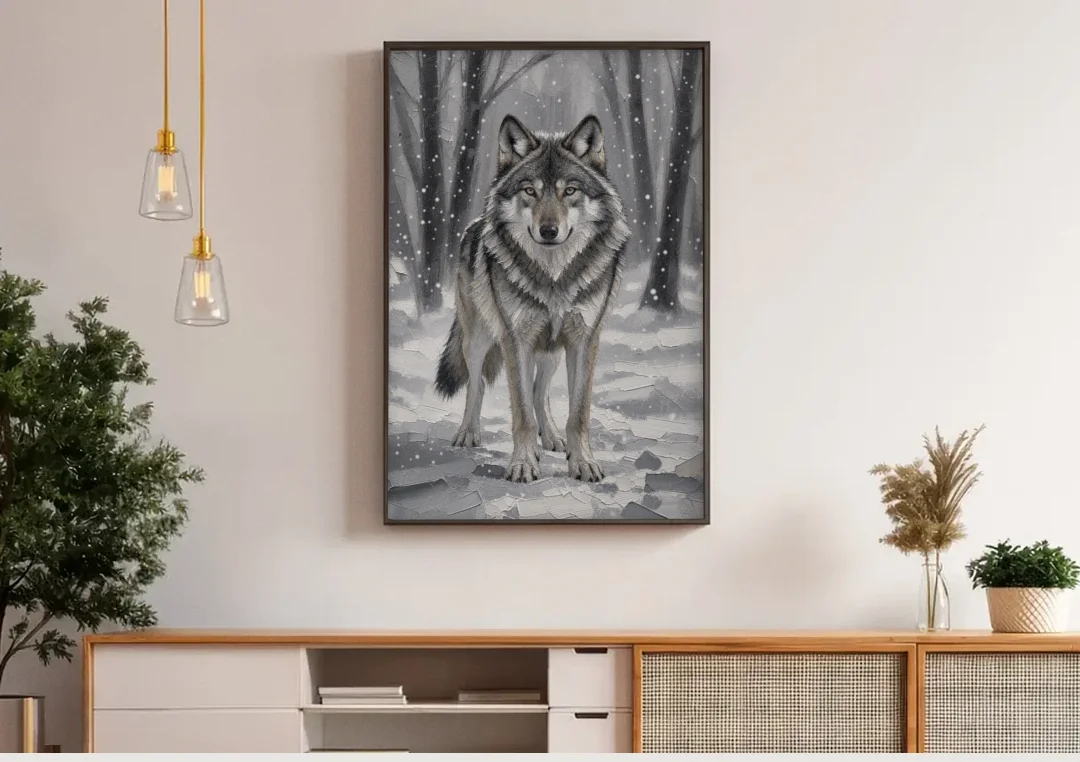 Gray Wolf in Falling Snow canvas wall art above a wooden sideboard under pendant lights