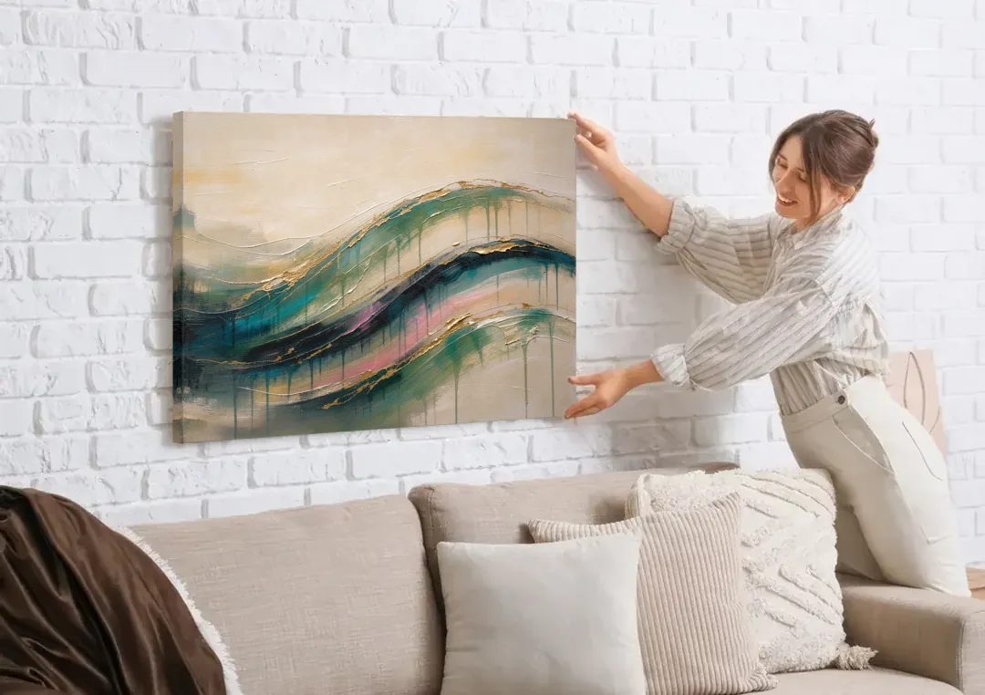 Green Abstract Emerald Tide with Gold Veins canvas wall art being hung on a white brick wall above a sofa