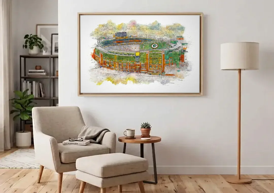 Green Bay Packers Lambeau Field Watercolor Stadium canvas wall art above an armchair in a bright living room