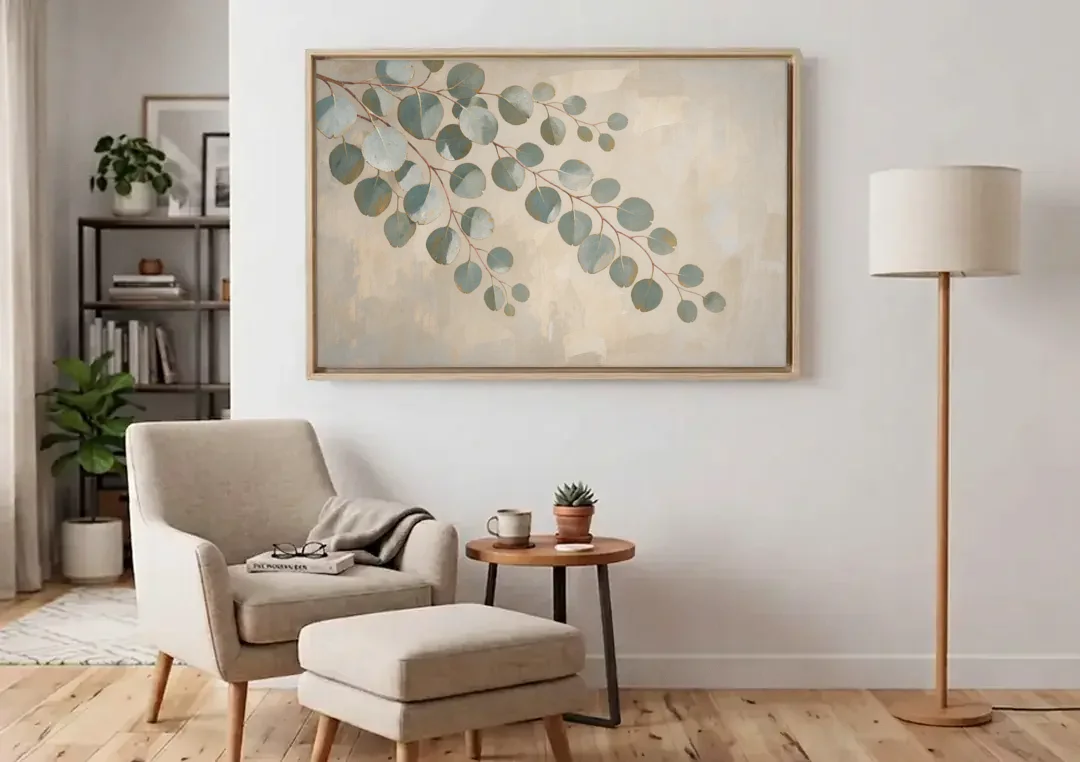 Greenery Wall Art of Trailing Silver Dollar Eucalyptus canvas wall art above an armchair in a bright living room