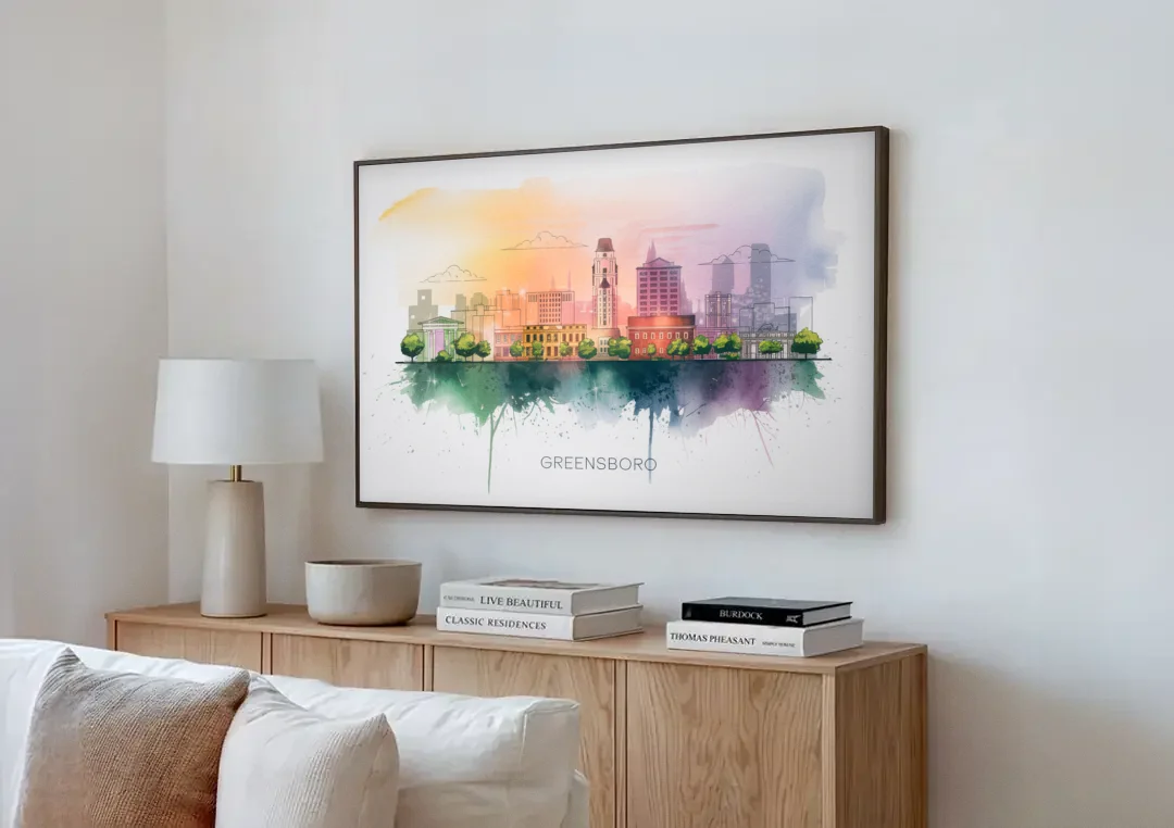 Greensboro Skyline Sunset canvas wall art above a wooden sideboard next to a sofa