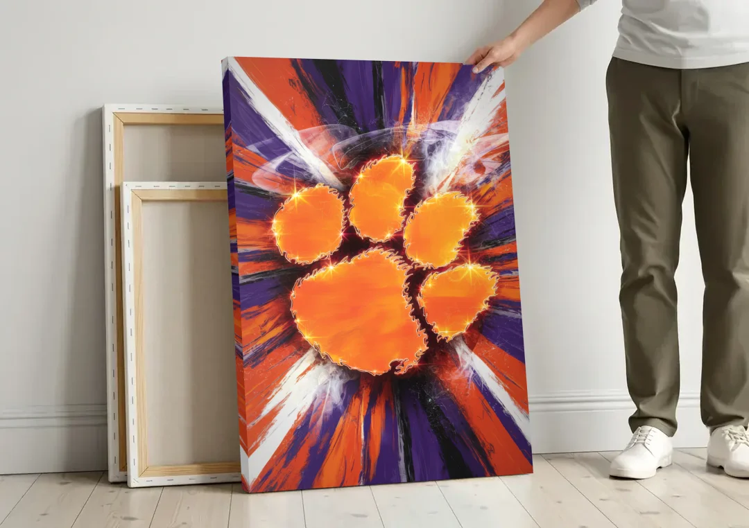 Greenville Clemson Tigers Pride canvas wall art leaning against a wall next to blank canvases