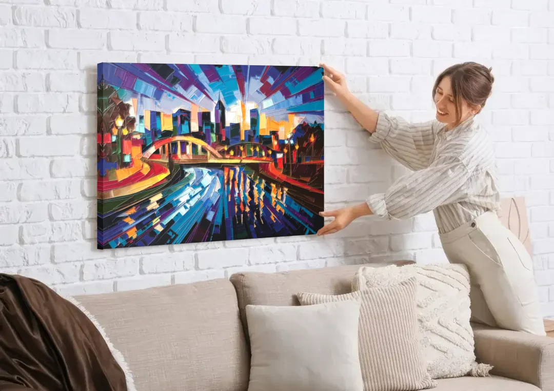 Greenville Vibrant Cityscape canvas wall art being hung on a white brick wall above a sofa