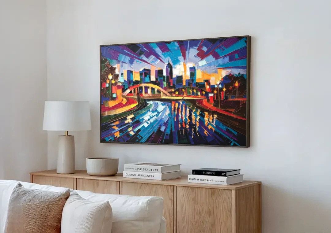 Greenville Vibrant Cityscape canvas wall art above a wooden sideboard next to a sofa