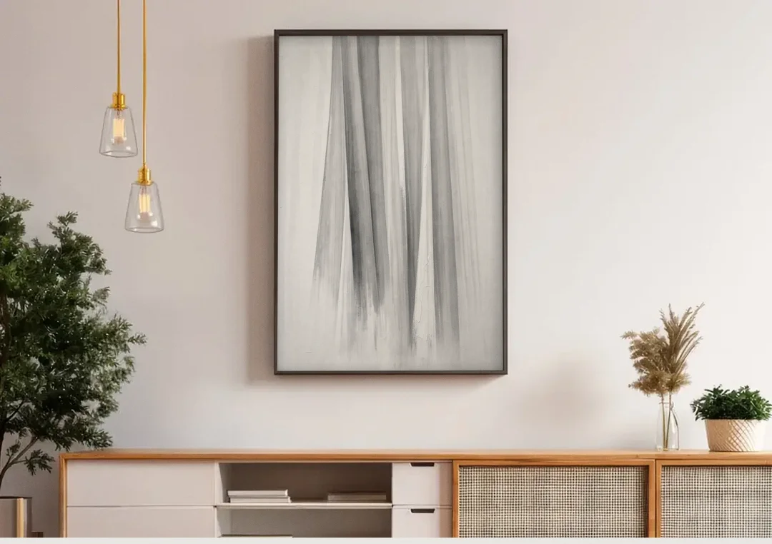 Grey and White Abstract Painting of Hanging Veils canvas wall art above a wooden sideboard under pendant lights