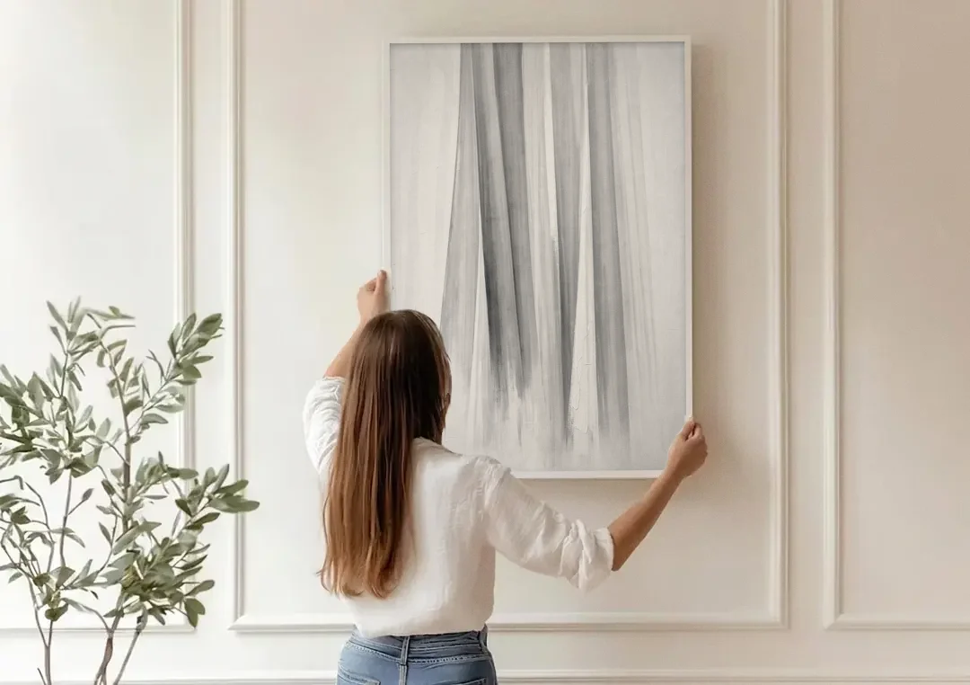 Grey and White Abstract Painting of Hanging Veils canvas wall art being hung on a paneled wall