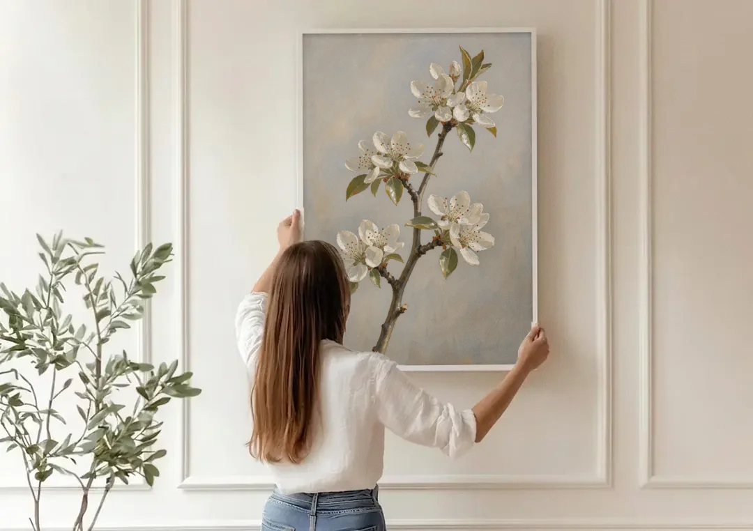 Grey Floral Wall Art with Pear Blossom Stem canvas wall art being hung on a paneled wall