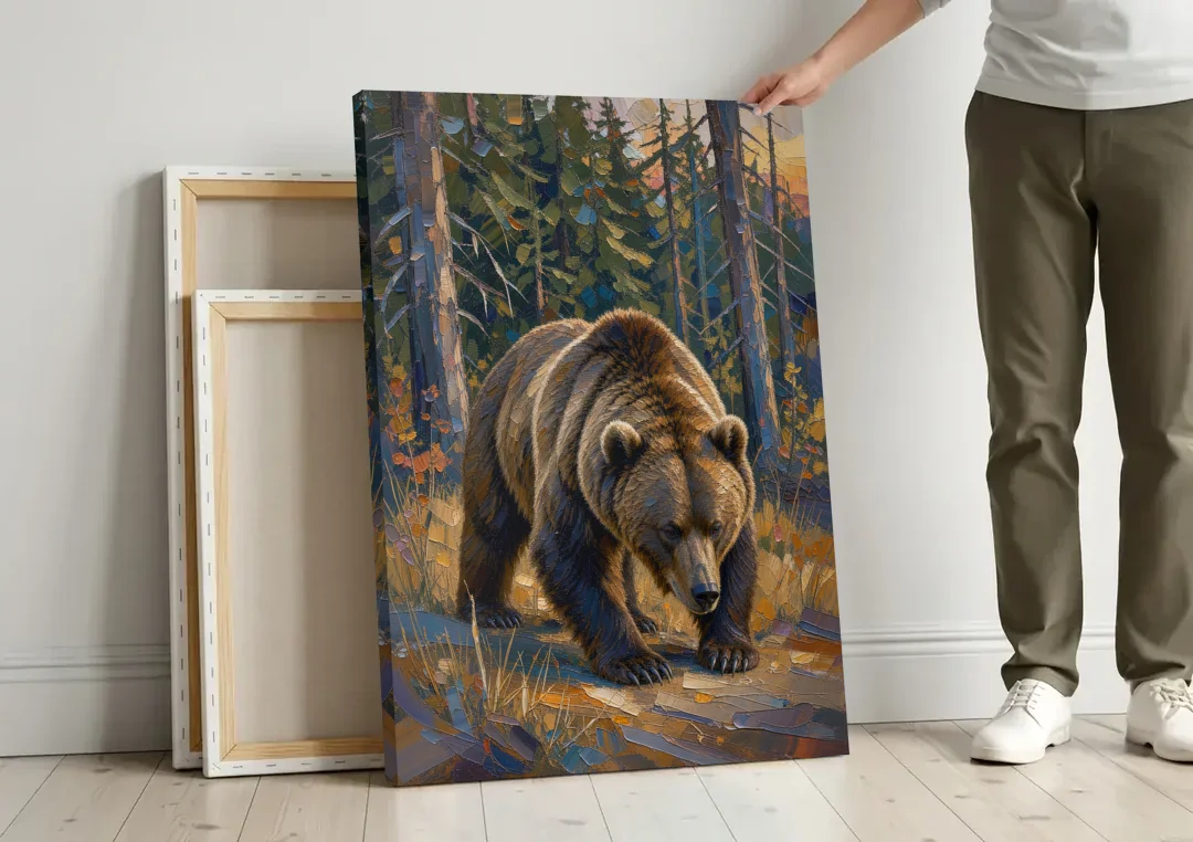 Grizzly in the Dusk Pines for the Man Cave canvas wall art leaning against a wall next to blank canvases