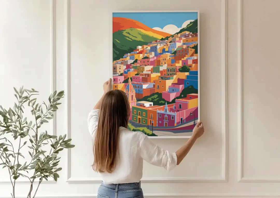Guanajuato Colorful Hills canvas wall art being hung on a paneled wall