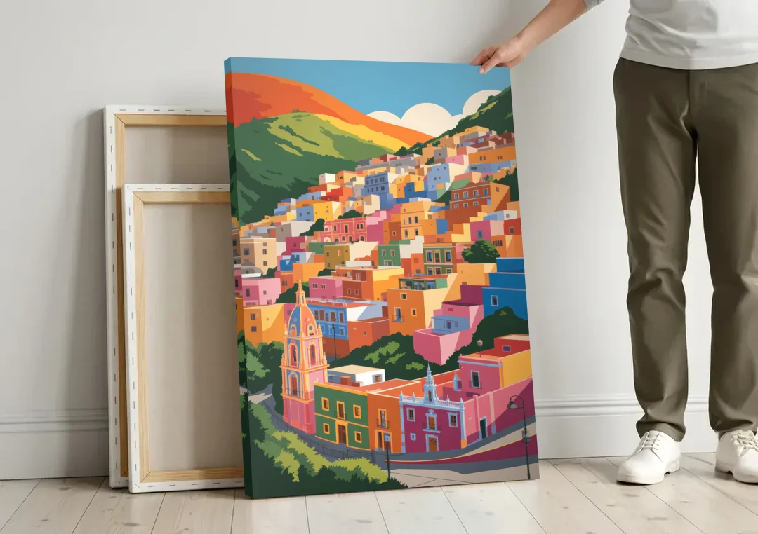 Guanajuato Colorful Hills canvas wall art leaning against a wall next to blank canvases