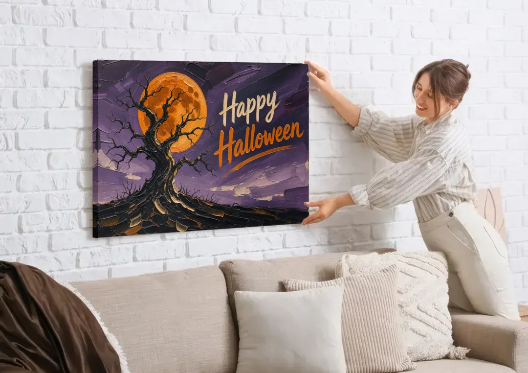Halloween Canvas Painting of a Moonlit Crooked Oak canvas wall art being hung on a white brick wall above a sofa