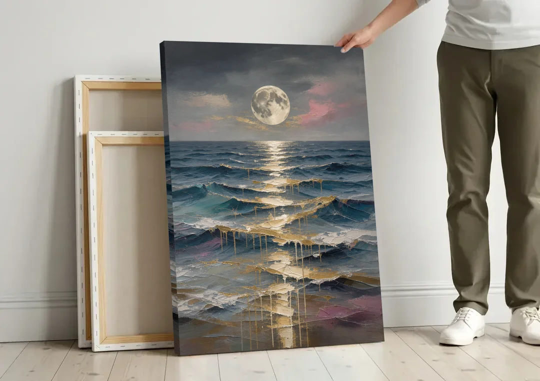 Hallway Wall Art with Gold Moonlight on Waves canvas wall art leaning against a wall next to blank canvases