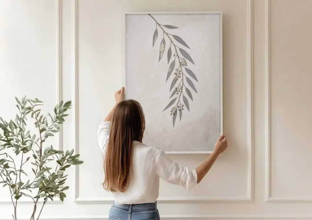 Hanging Eucalyptus Sprig with Seed Clusters canvas wall art being hung on a paneled wall