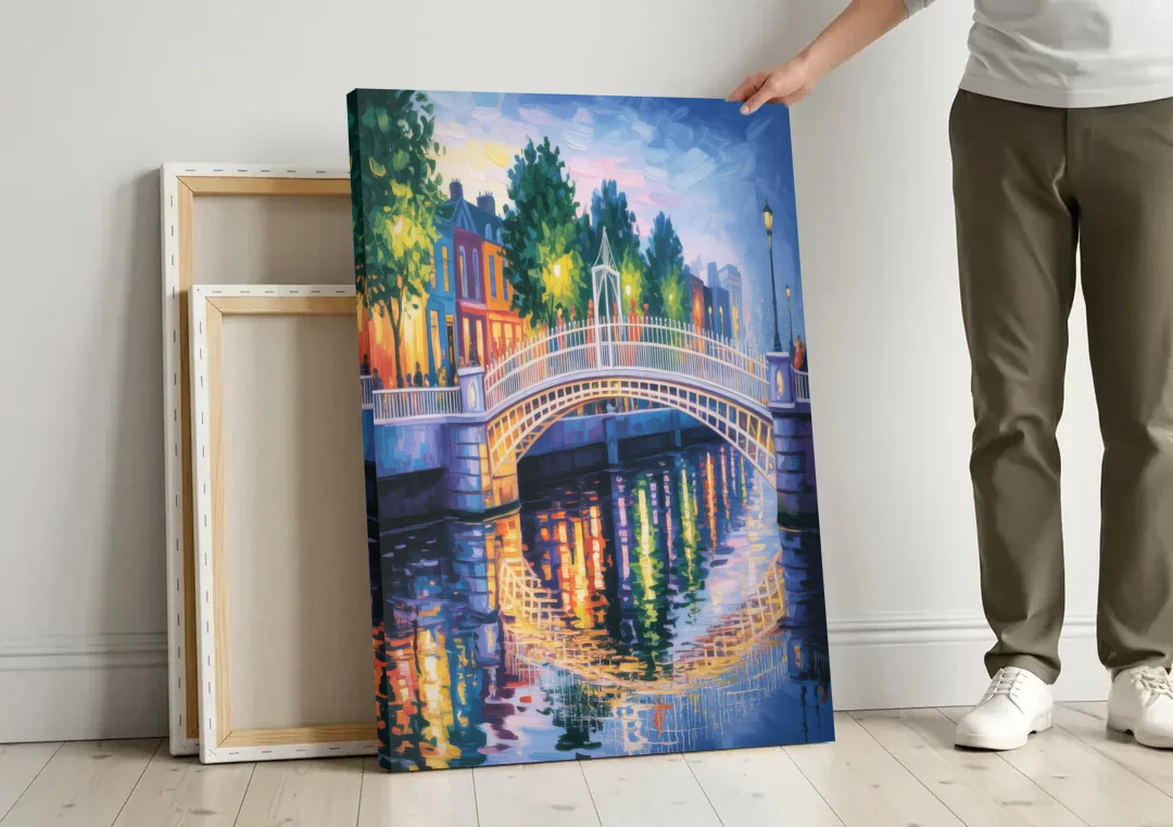 Ha'penny Bridge Views canvas wall art leaning against a wall next to blank canvases